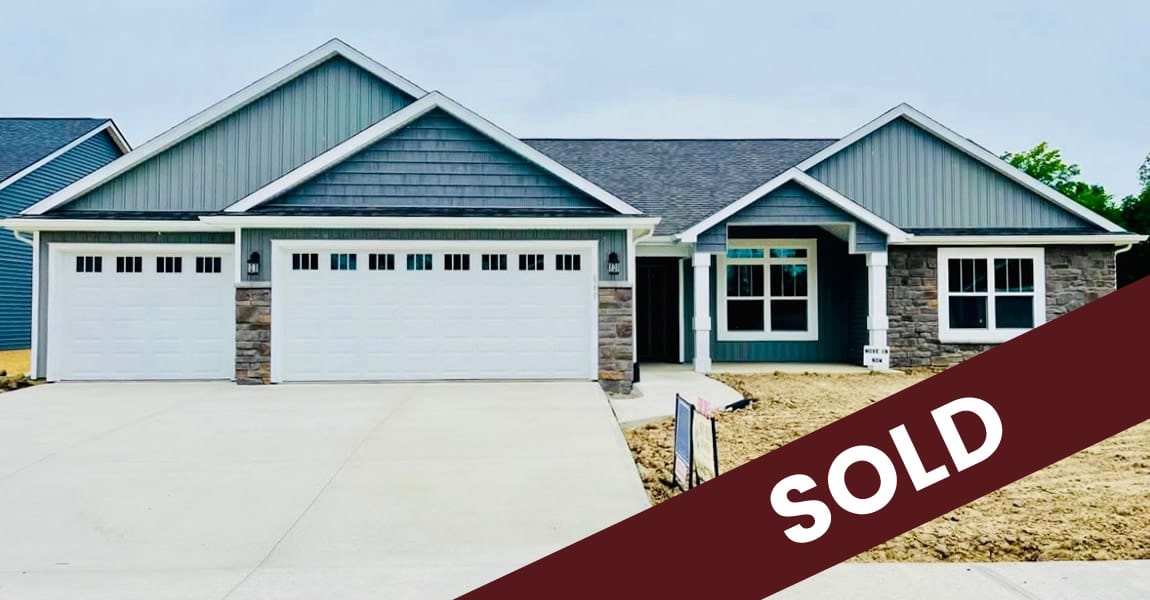 Picture of a house with a sold sign.